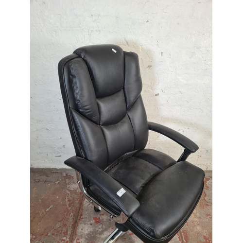 70 - A modern black leatherette and chrome plated swivel office desk chair