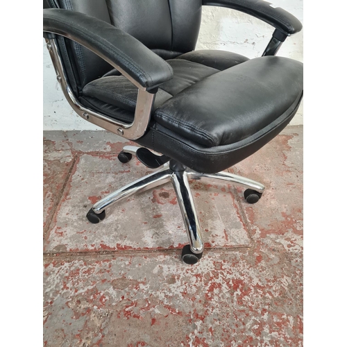 71 - A modern black leatherette and chrome plated swivel office desk chair