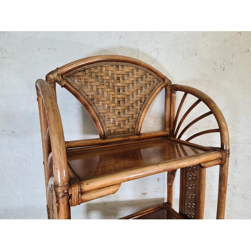 79 - A bamboo and wicker four tier free standing bookcase - approx. 177cm high x 67cm wide x 35cm deep