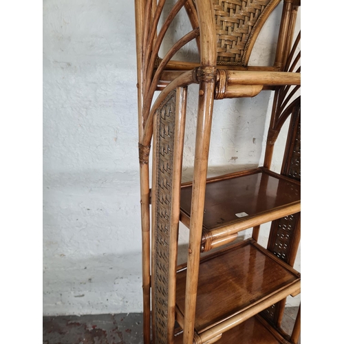 79 - A bamboo and wicker four tier free standing bookcase - approx. 177cm high x 67cm wide x 35cm deep