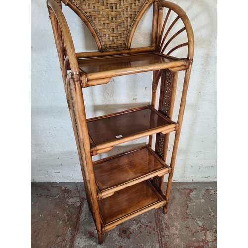 79 - A bamboo and wicker four tier free standing bookcase - approx. 177cm high x 67cm wide x 35cm deep