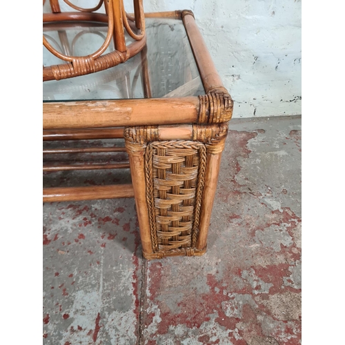 80 - Three pieces of bamboo and wicker furniture, one rectangular coffee table with glass insert, one two... 