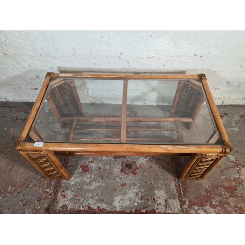 80 - Three pieces of bamboo and wicker furniture, one rectangular coffee table with glass insert, one two... 