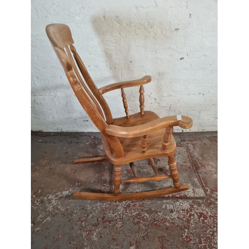 84 - A Victorian style solid beech farmhouse rocking chair