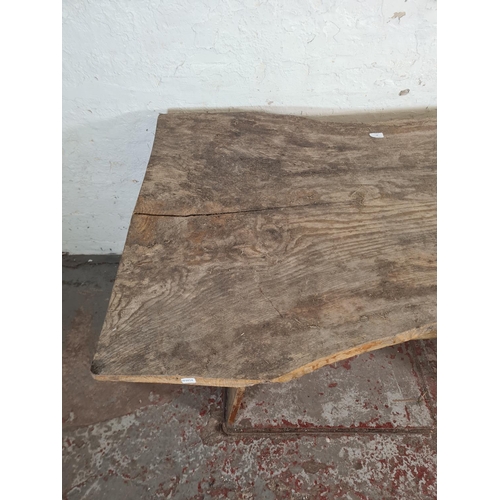 87 - A rustic elm dining table - approx. 76cm high x 90cm wide x 129cm long