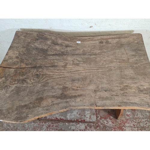 87 - A rustic elm dining table - approx. 76cm high x 90cm wide x 129cm long