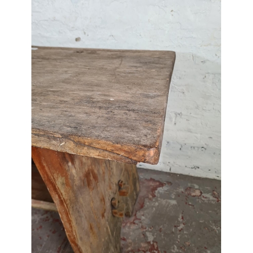 87 - A rustic elm dining table - approx. 76cm high x 90cm wide x 129cm long