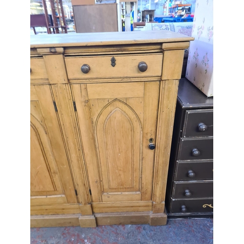 92 - A Victorian Gothic Revival solid pine sideboard with three drawers and three lower cupboard doors - ... 