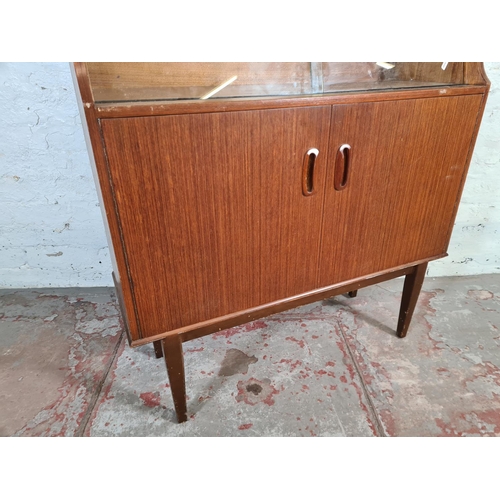 95 - A mid 20th century Portwood Furniture teak bookcase - approx. 130cm high x 90cm wide x 32cm deep