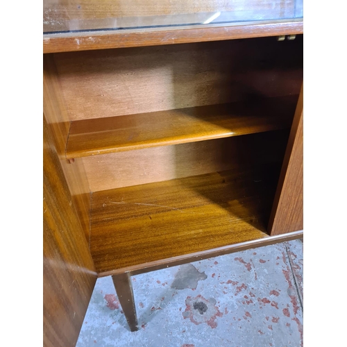 95 - A mid 20th century Portwood Furniture teak bookcase - approx. 130cm high x 90cm wide x 32cm deep