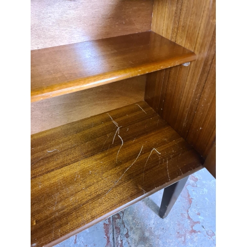 95 - A mid 20th century Portwood Furniture teak bookcase - approx. 130cm high x 90cm wide x 32cm deep