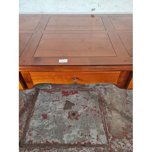 143C - A French Joseph Grange cherry wood writing desk with three drawers - approx. 76cm high x 130cm wide ... 