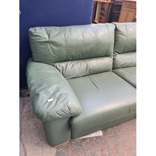 73A - A modern green leather three seater sofa