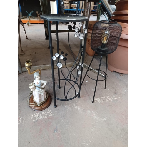 740 - Three items to include, ceramic figural lamp, battery powered outdoor light etc.