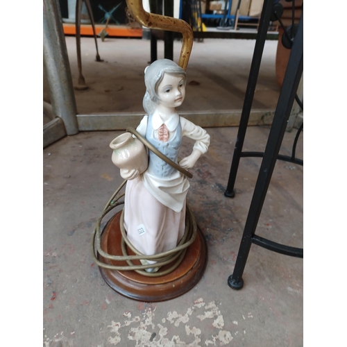 740 - Three items to include, ceramic figural lamp, battery powered outdoor light etc.