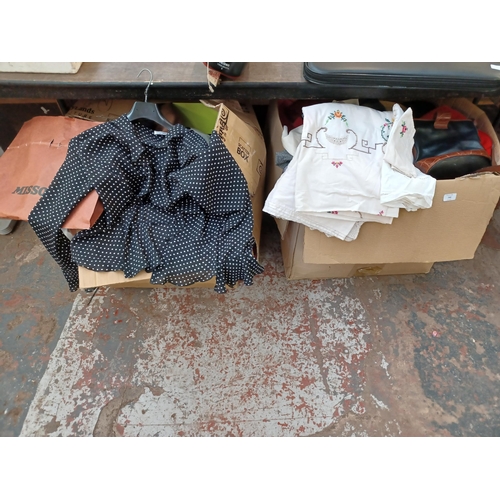 742 - Two large boxes containing a collection of clothing, bags and fabrics