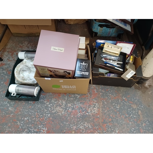 744 - Three boxes containing boxed Maslin pan, framed pictures, pens, Thermos flasks etc.