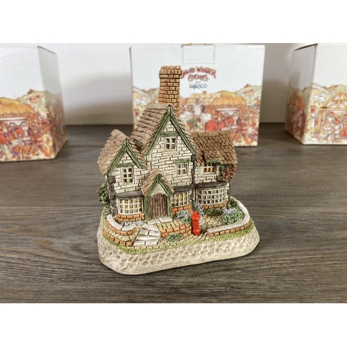 296 - Three boxed Enesco David Winter signed cottages,  The Mash House, Mistletoe Cottage and the Post off... 