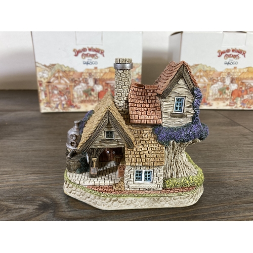 296 - Three boxed Enesco David Winter signed cottages,  The Mash House, Mistletoe Cottage and the Post off... 