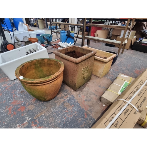 549 - Five terracotta and glazed planters - largest approx. 41cm high