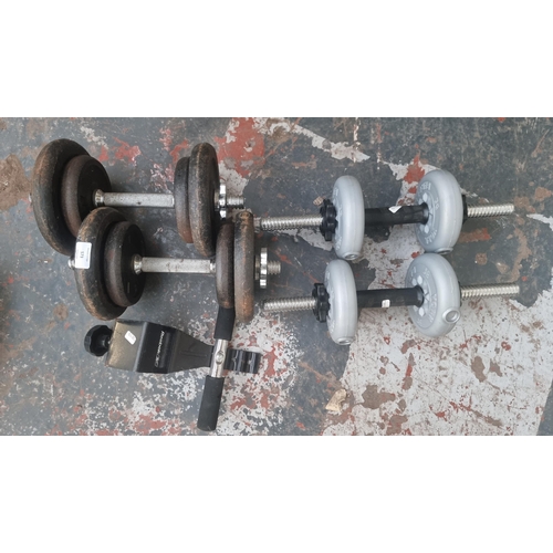 573 - Two pairs of dumbbells with various sized weights