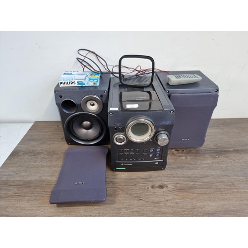 610 - Two items, one Sony CHC-CL3 mini stereo system comprising three CD changer, tuner, tape player, pair... 