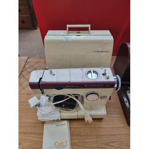 711 - A cased Frister + Rossmann Cub 7 compact freearm super-automatic electric sewing machine with foot p... 