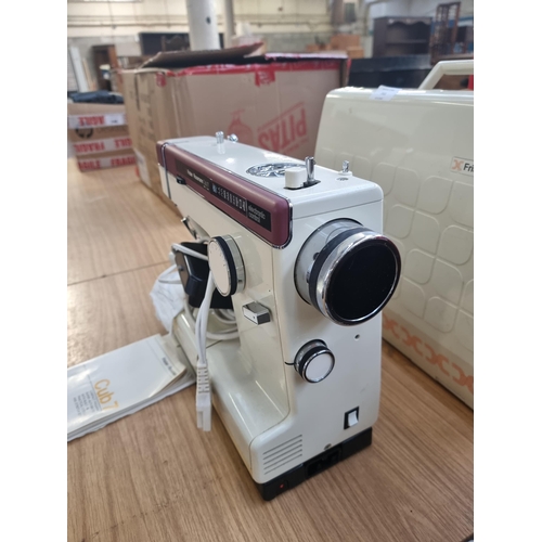 711 - A cased Frister + Rossmann Cub 7 compact freearm super-automatic electric sewing machine with foot p... 