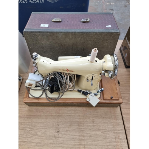 716 - A cased Sherwood electric sewing machine with foot pedal