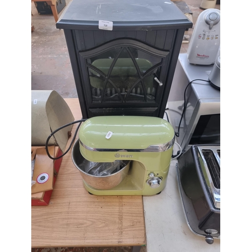 719 - Two items, one Swan 4.2L food mixer and one Manor stove effect electric heater