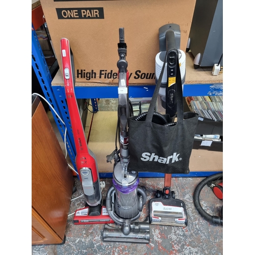 729 - Three upright bagless vacuum cleaners, one Bosch Athlet 18v, one Dyson DC25 and one Shark Duo Clean ... 