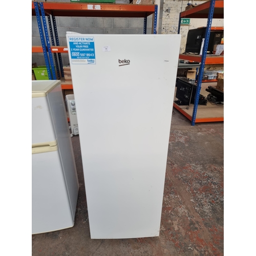 735 - A Beko upright freezer approx 145cm high