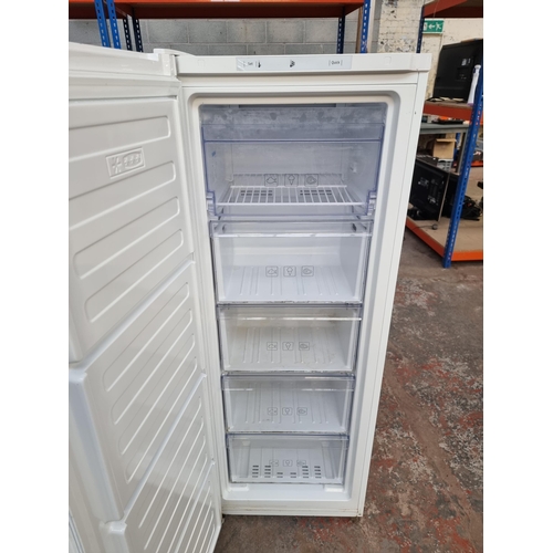 735 - A Beko upright freezer approx 145cm high