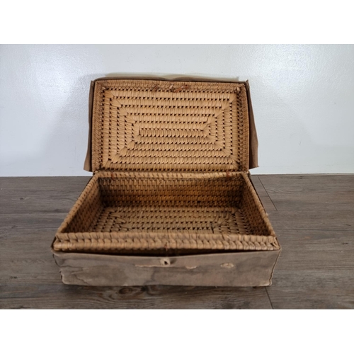 513 - An early 20th century wicker basket with canvas casing - approx. 15cm high x 44cm wide x 27cm deep