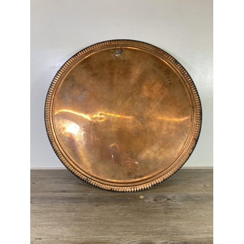 304 - A mid 20th century Oriental engraved copper charger - approx. 60cm diameter