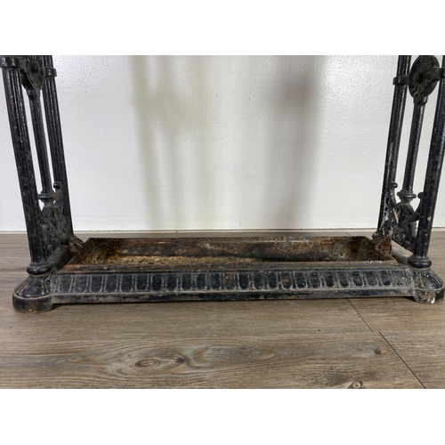 307 - A Victorian Coalbrookdale cast iron six section stick stand, with original drip tray, impressed kite... 