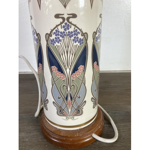 472 - An Art Nouveau style ceramic table lamp on wooden plinth - approx. 35cm high