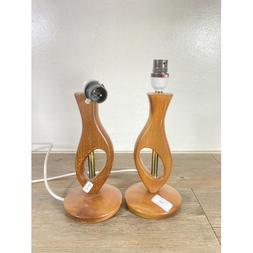 475 - A pair of mid 20th century teak table lamps - approx. 30cm high