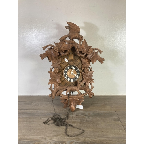 482 - A German Regula carved wood cuckoo clock - approx. 50cm high