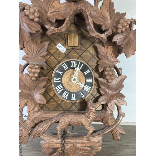 482 - A German Regula carved wood cuckoo clock - approx. 50cm high