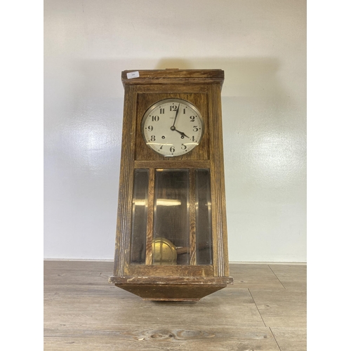 484 - A Vedette oak cased chiming wall clock with pendulum - approx. 70cm high x 33cm wide x 18cm deep