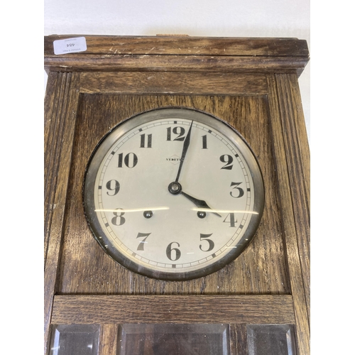 484 - A Vedette oak cased chiming wall clock with pendulum - approx. 70cm high x 33cm wide x 18cm deep