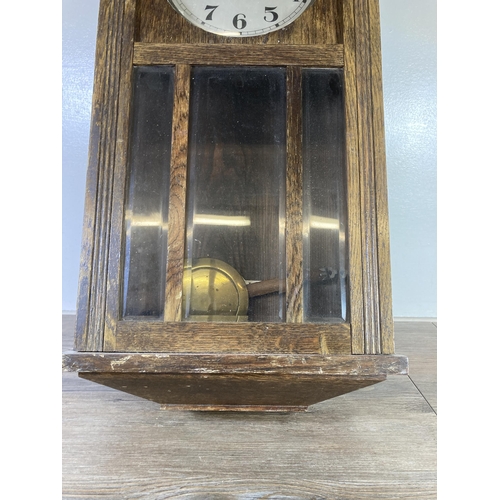 484 - A Vedette oak cased chiming wall clock with pendulum - approx. 70cm high x 33cm wide x 18cm deep