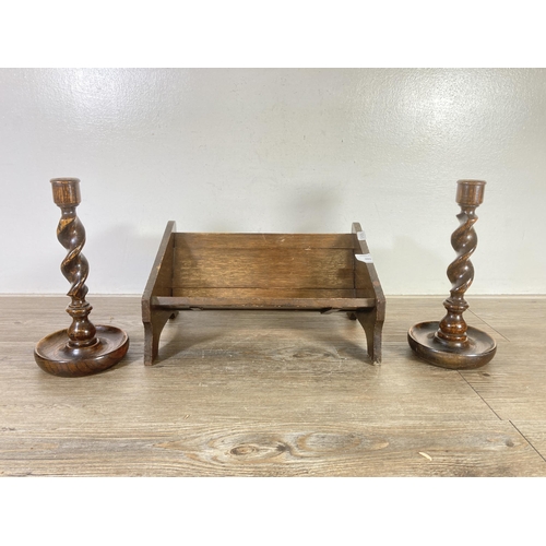 486 - Three early/mid 20th century oak items, two barley twist candlesticks - approx. 25cm high and one ex... 