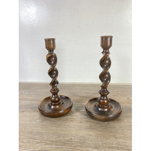 486 - Three early/mid 20th century oak items, two barley twist candlesticks - approx. 25cm high and one ex... 