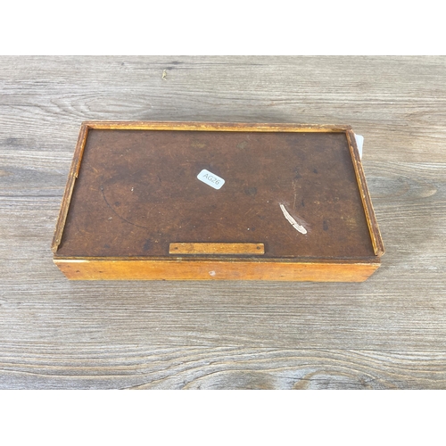 492 - A mid 20th century wooden cased set of printing blocks