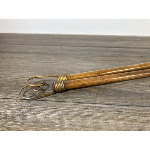 499 - A pair of vintage wooden curtain draw poles - approx. 102cm long