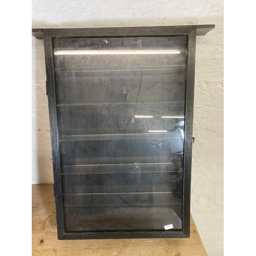 502 - Three vintage black painted and glass wall mountable display cabinets - approx. 63cm high x 52cm wid... 