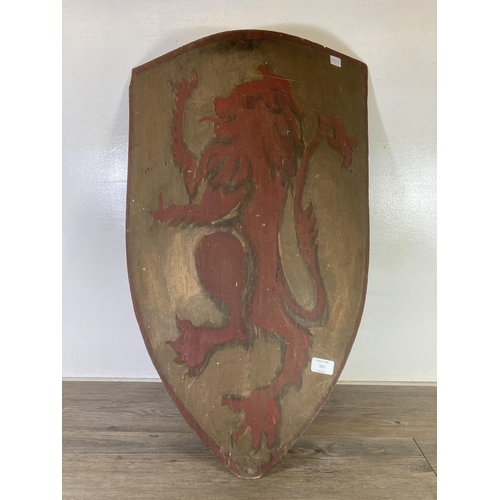 505 - A Medieval style hand painted wooden re-enactment shield - approx. 75cm high x 46cm wide