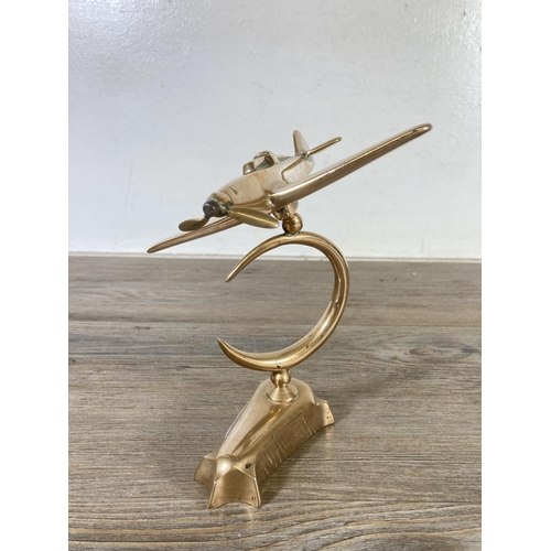 508 - A mid 20th century brass model of a spitfire